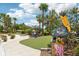 Playful putting green features whimsical artwork among tropical landscaping at 23346 Abercorn Ln, Land O Lakes, FL 34639