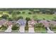 Street view of the residences with well-manicured lawns overlooking a large greenway at 23346 Abercorn Ln, Land O Lakes, FL 34639
