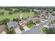 Overhead view of a residence with a well-manicured lawn, and long driveway at 23346 Abercorn Ln, Land O Lakes, FL 34639