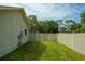 Fenced backyard offers privacy and security in a well-manicured setting at 2421 Eagle Chase Dr, Palm Harbor, FL 34683