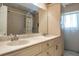 Bathroom with double sink and a granite countertop at 2421 Eagle Chase Dr, Palm Harbor, FL 34683