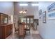 Dining area with natural light and seamless connection to the office and kitchen at 2421 Eagle Chase Dr, Palm Harbor, FL 34683