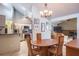 Open-concept space with views of kitchen, dining area with wood table, and cozy living room at 2421 Eagle Chase Dr, Palm Harbor, FL 34683