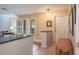 Bright entryway featuring tile flooring, shuttered windows, and an open layout, offering a welcoming ambiance at 2421 Eagle Chase Dr, Palm Harbor, FL 34683