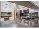 Kitchen featuring granite countertops, stainless steel appliances and sink with a view to dining area at 2421 Eagle Chase Dr, Palm Harbor, FL 34683