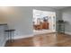 Open floor plan showcasing the dining room with chandelier and light wood floors throughout the living area at 2421 Eagle Chase Dr, Palm Harbor, FL 34683