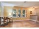 Inviting living room with hardwood floors, shuttered windows, and ample natural light, creating a cozy atmosphere at 2421 Eagle Chase Dr, Palm Harbor, FL 34683