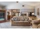Living room showcases neutral paint, tile floor, and pass through to the kitchen at 2421 Eagle Chase Dr, Palm Harbor, FL 34683