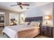 Main bedroom featuring ceiling fan and ensuite bathroom at 2421 Eagle Chase Dr, Palm Harbor, FL 34683