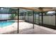Outdoor patio featuring a ceiling fan and a view of the pool at 2421 Eagle Chase Dr, Palm Harbor, FL 34683