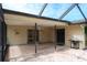 Covered outdoor living area features ceiling fan, flagstone patio, and easy access to the home's interior at 2421 Eagle Chase Dr, Palm Harbor, FL 34683