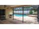 Relaxing screened-in pool area with in-ground pool, spa, and flagstone patio with room for entertaining at 2421 Eagle Chase Dr, Palm Harbor, FL 34683