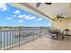Expansive balcony for outdoor dining with stunning water views and ample space at 3805 Gulf Blvd # 401, St Pete Beach, FL 33706