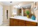 Bathroom features a large vanity, wood cabinets, modern fixtures, and neutral color scheme at 3805 Gulf Blvd # 401, St Pete Beach, FL 33706