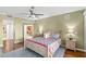 Comfortable bedroom with hardwood floors, en suite bathroom, and view to the dining room at 3805 Gulf Blvd # 401, St Pete Beach, FL 33706