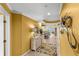 Bright, inviting hallway with stylish decor and a glimpse of the open-concept living area at 3805 Gulf Blvd # 401, St Pete Beach, FL 33706