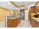 This kitchen provides ample storage, stainless steel appliances, granite countertops, and a center island at 3805 Gulf Blvd # 401, St Pete Beach, FL 33706