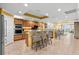 A spacious kitchen features an extended island, stainless appliances, and an adjacent dining area with water views at 3805 Gulf Blvd # 401, St Pete Beach, FL 33706