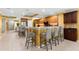 An expansive kitchen offers ample bar seating, stainless appliances, and a large island perfect for entertaining at 3805 Gulf Blvd # 401, St Pete Beach, FL 33706