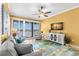 Living room with comfortable seating, scenic water views, a ceiling fan, and modern decor create a relaxing space at 3805 Gulf Blvd # 401, St Pete Beach, FL 33706