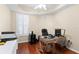 This office has a neutral color scheme, wood floors, white plantation shutters, and a modern desk at 3805 Gulf Blvd # 401, St Pete Beach, FL 33706