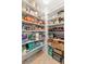 A well-stocked pantry features multiple shelves, providing ample storage for food and kitchen essentials at 3805 Gulf Blvd # 401, St Pete Beach, FL 33706