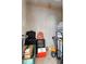 Unfinished storage space with luggage, boxes, and other items, providing additional storage at 3805 Gulf Blvd # 401, St Pete Beach, FL 33706