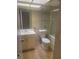 Bathroom featuring a vanity, toilet, and tiled shower, offering a functional and well-lit space at 5125 Puritan Cir # 1103, Tampa, FL 33617