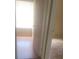 Bedroom featuring wood floors, a window, and an open doorway to the adjacent room at 5125 Puritan Cir # 1103, Tampa, FL 33617