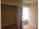 Bedroom closet and shelving unit with wood flooring, and a window view for natural light at 5125 Puritan Cir # 1103, Tampa, FL 33617