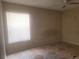 Bedroom featuring window with blinds, overhead fan, ample natural light, and patterned tile flooring at 5125 Puritan Cir # 1103, Tampa, FL 33617