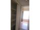 Open closet featuring shelving and storage space, with a glimpse into an adjacent room at 5125 Puritan Cir # 1103, Tampa, FL 33617