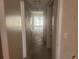 Hallway view featuring doors and access to gated outdoor light, showcasing the property's layout at 5125 Puritan Cir # 1103, Tampa, FL 33617