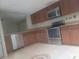 Well-lit kitchen features stainless steel appliances, ample counter space, and classic cabinetry at 5125 Puritan Cir # 1103, Tampa, FL 33617