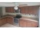 Well-equipped kitchen with plenty of cabinets, a stainless steel oven, and ample counter space at 5125 Puritan Cir # 1103, Tampa, FL 33617