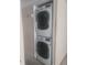 Stackable washer and dryer unit in a laundry closet at 5125 Puritan Cir # 1103, Tampa, FL 33617