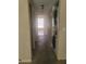 Hallway laundry closet featuring a stacked washer and dryer unit at 5125 Puritan Cir # 1103, Tampa, FL 33617
