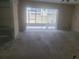 Empty living room featuring a sliding glass doors to the patio at 5125 Puritan Cir # 1103, Tampa, FL 33617