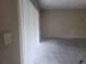 Spacious living room with vertical blinds, awaiting your personal touch and customization at 5125 Puritan Cir # 1103, Tampa, FL 33617