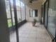Screened-in patio space with tile floor and views of the backyard area at 5125 Puritan Cir # 1103, Tampa, FL 33617