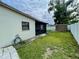 Backyard features a well-maintained lawn, fence, shed, and exterior of the house at 7026 20Th N St, St Petersburg, FL 33702
