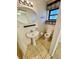 Bathroom with a pedestal sink, toilet, and tiled floor, features shelving at 7026 20Th N St, St Petersburg, FL 33702