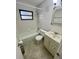 A traditional bathroom with white fixtures and a combination tub and shower at 7026 20Th N St, St Petersburg, FL 33702