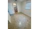 A bedroom has terrazzo flooring, a sink, and a window with a blind at 7026 20Th N St, St Petersburg, FL 33702
