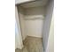 A white empty closet has a single white pole for hanging clothes at 7026 20Th N St, St Petersburg, FL 33702