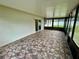 A large Florida room with tile flooring at 7026 20Th N St, St Petersburg, FL 33702