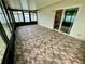 A large Florida room with an entrance to the kitchen provides a great extra space at 7026 20Th N St, St Petersburg, FL 33702