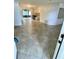 Inviting open-concept floor plan featuring neutral-toned tile flooring leading to the kitchen at 7026 20Th N St, St Petersburg, FL 33702