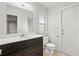 Updated bathroom featuring a vanity with dark wood cabinets and a large mirror at 7108 14Th Nw Ave, Bradenton, FL 34209