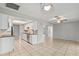 Open kitchen featuring white cabinets, stainless steel appliances, tile backsplash, and tile flooring at 7108 14Th Nw Ave, Bradenton, FL 34209